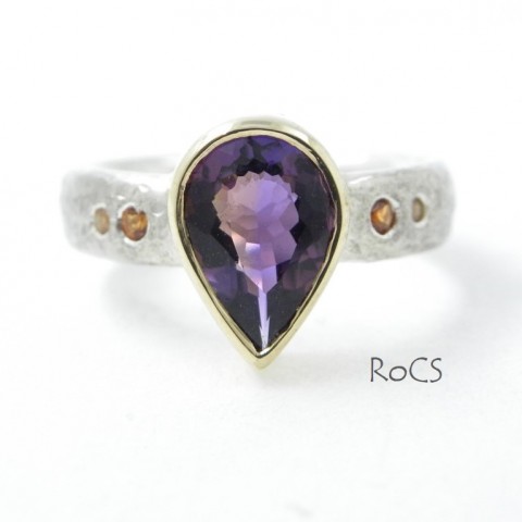 Ametrine ring set in silver with sapphires and garnets image