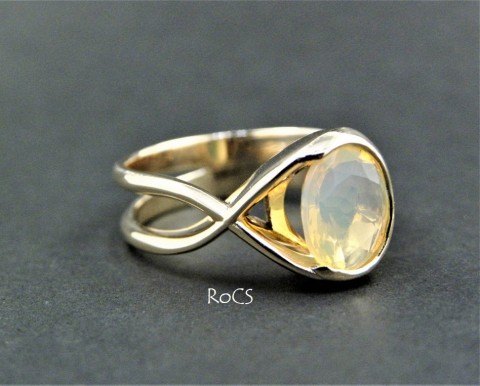 Opal set in by-pass gold band image