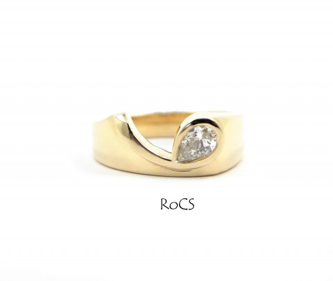 Pear cut diamond set in Koru style band image