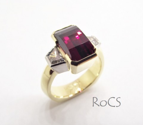 Custom cut rhodolite with trapezoid diamonds image