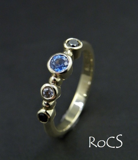 Sapphire and diamond rub set band image