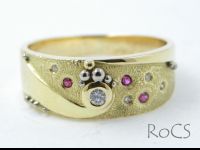 Textured, punch set diamond and ruby band image