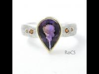 Ametrine ring set in silver with sapphires and garnets image