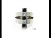 Contemporary black and white diamond set ring image