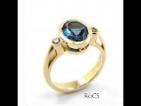 Blue topaz in rub setting with diamond accents image